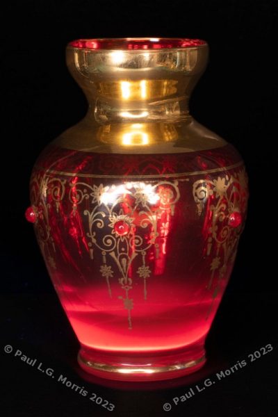 Vase in white light with UV fluorescence superimposed